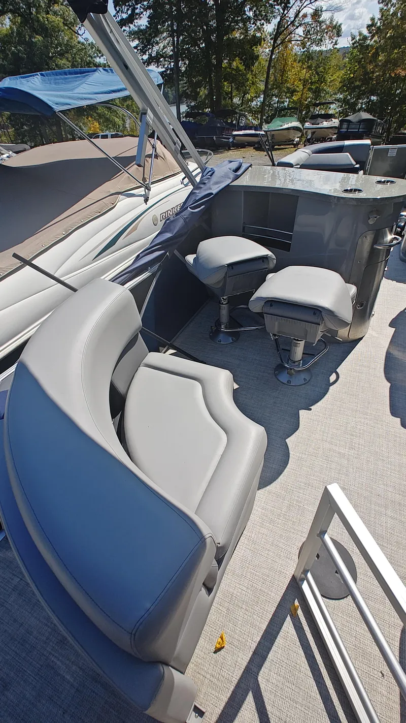Slide: The Image of 2023 South Bay 523E 2.75 pontoon boat with gray seating and modern design. - 15
