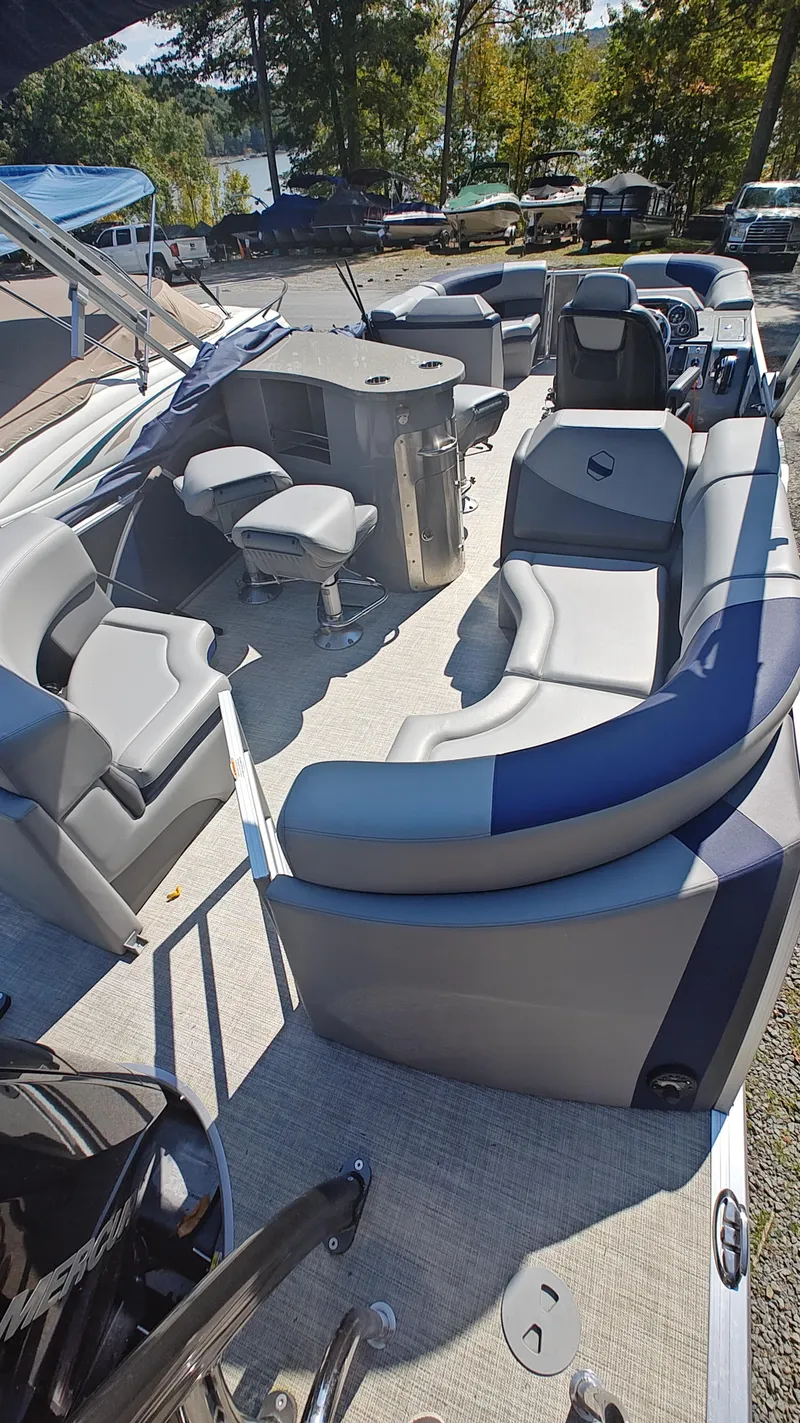 Slide: The Image of 2023 South Bay 523E 2.75 pontoon boat interior with spacious seating and modern design. - 7