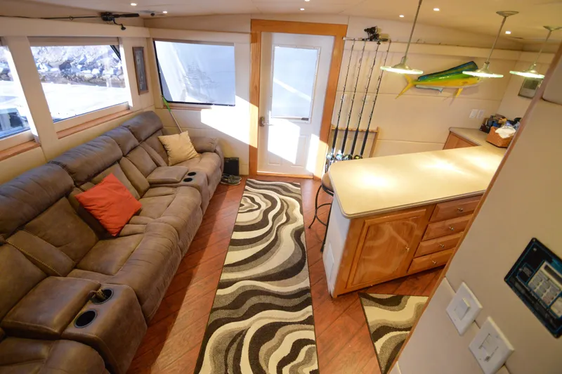 Slide: The Image of Luxurious 2004 Chesapeake 58 boat interior with plush seating and modern kitchen area. - 10