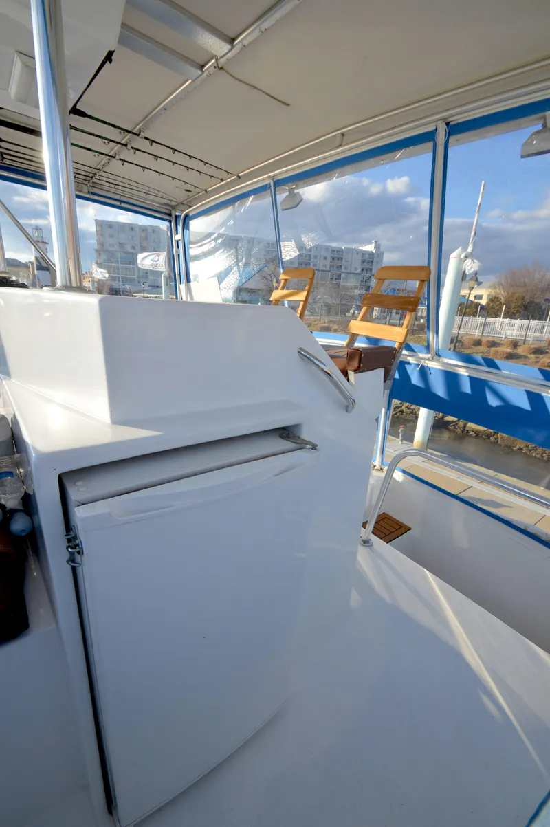 Slide: The Image of Interior of 2004 Chesapeake 58 boat with seating and modern amenities. - 32