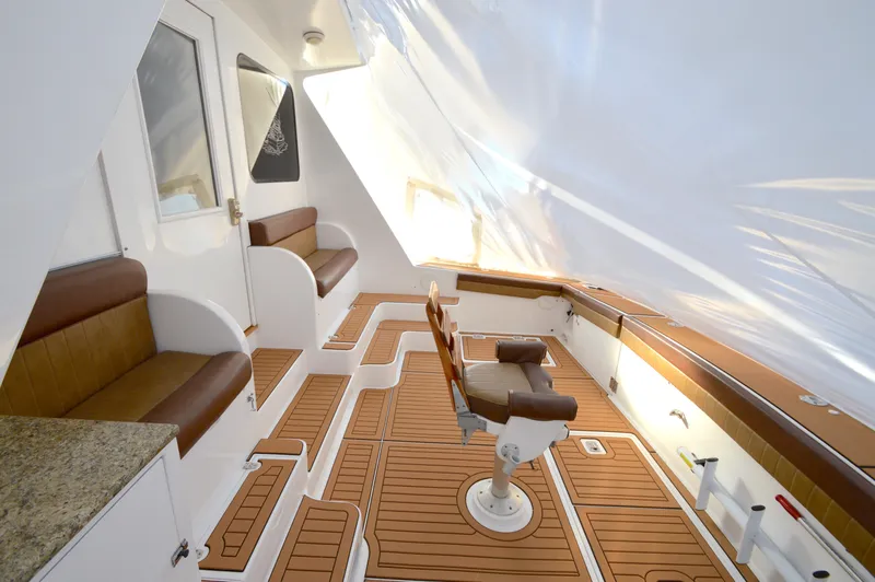 Slide: The Image of Luxurious 2004 Chesapeake 58 boat interior with teak flooring and comfortable seating. - 39