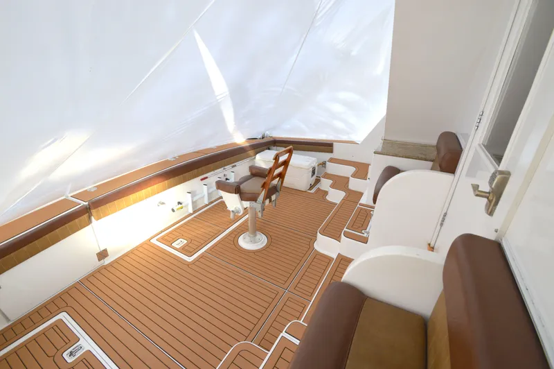 Slide: The Image of Spacious deck of 2004 Chesapeake 58 boat with teak flooring and seating. - 41
