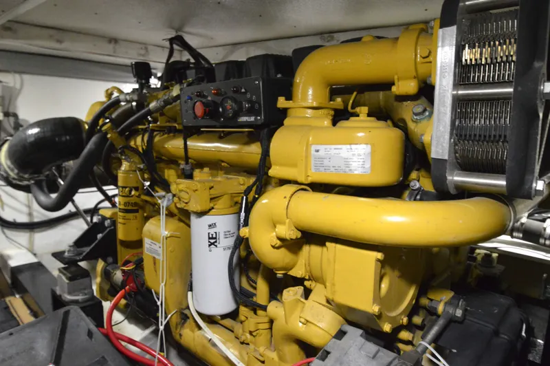 Slide: The Image of Yellow engine in 2004 Chesapeake 58 boat, showcasing intricate mechanical components. - 42