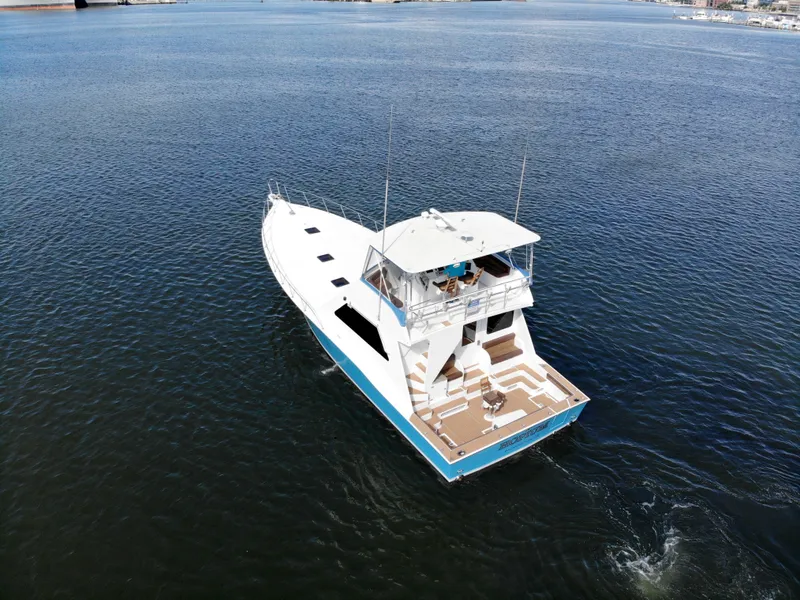 Slide: The Image of 2004 Chesapeake 58 boat cruising on open water, aerial view. - 44