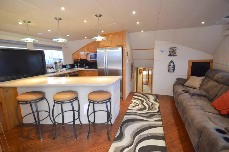 Slide: The Image of Luxurious 2004 Chesapeake 58 boat interior with modern kitchen and cozy seating area. - 6