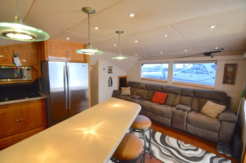 Slide: The Image of Luxurious 2004 Chesapeake 58 yacht interior with modern kitchen and cozy seating area. - 9