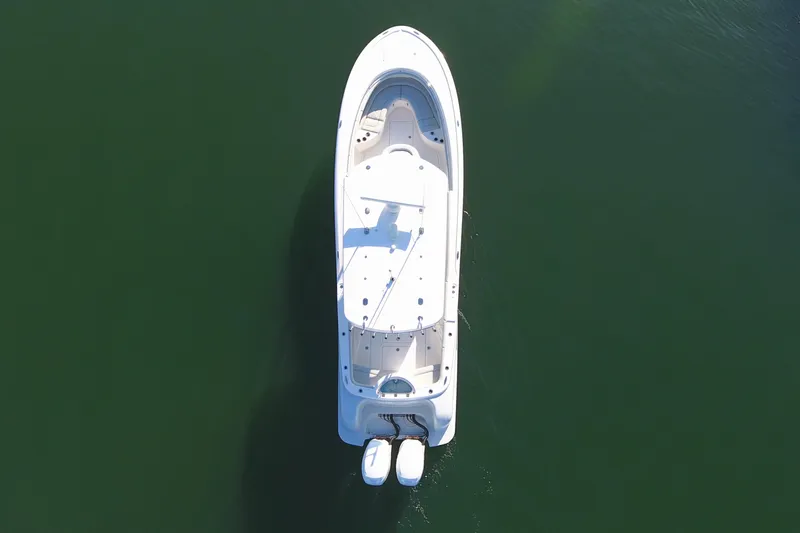 Slide: The Image of Aerial view of 2023 Mag Bay 33 CC boat on calm water. - 11