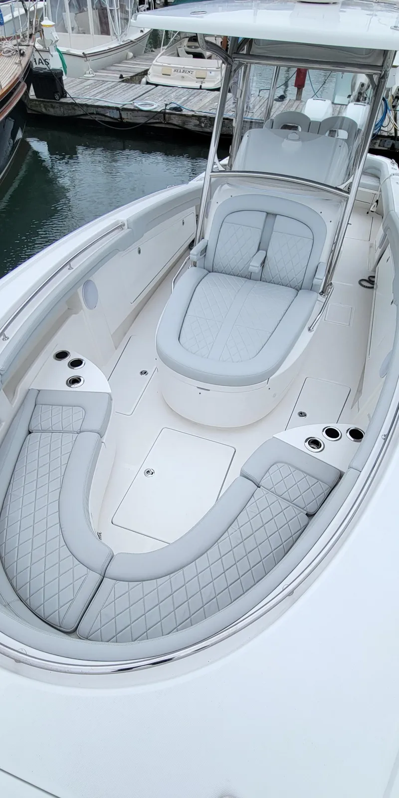 Slide: The Image of 2023 Mag Bay 33 CC boat with sleek seating and modern design. - 18