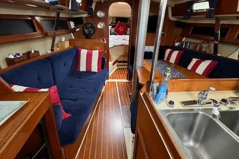 Slide: The Image of Interior of a 1986 Pearson 36 sailboat with cozy seating and nautical decor. - 3