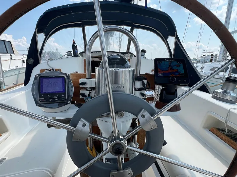 Slide: The Image of Cockpit of a 1986 Pearson 36 sailboat with steering wheel and navigation instruments. - 6