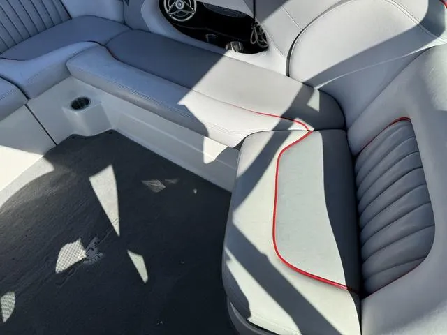 Slide: The Image of 2006 Centurion Enzo SV216 boat interior with gray and red-trimmed seating. - 13