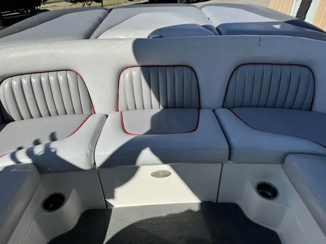 Slide: The Image of 2006 Centurion Enzo SV216 boat interior with gray seating and red accents. - 14