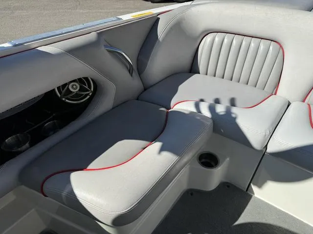 Slide: The Image of 2006 Centurion Enzo SV216 boat interior with gray seating and red trim. - 15