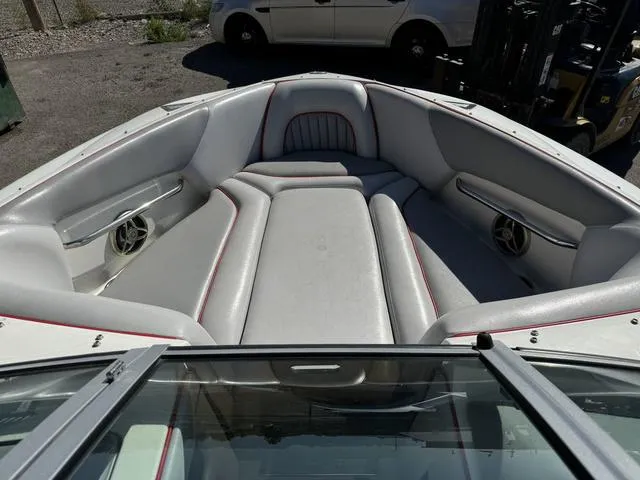 Slide: The Image of 2006 Centurion Enzo SV216 boat interior with gray seating and speakers. - 6