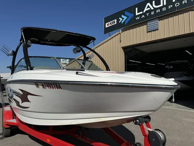 Slide: The Image of 2006 Centurion Enzo SV216 boat on red trailer at watersports facility. - 8