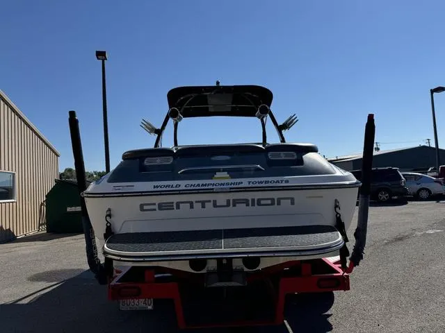 Slide: The Image of 2006 Centurion Enzo SV216 towboat parked outdoors, rear view. - 9