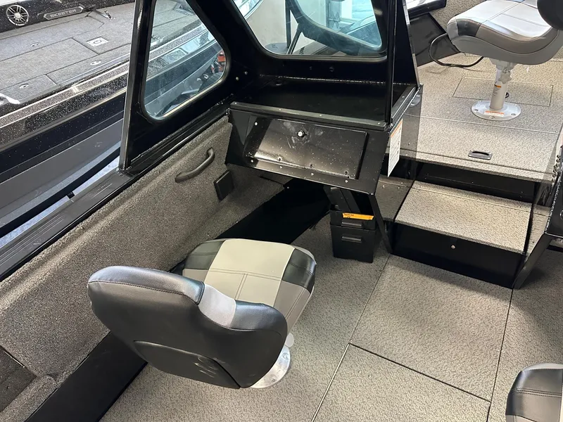 Slide: The Image of Interior of 2025 Crestliner 2050 Commander boat with seating and console. - 5