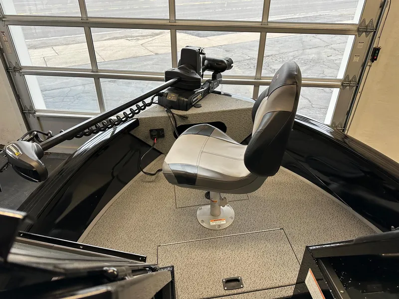 Slide: The Image of 2025 Crestliner 2050 Commander boat interior with swivel seat and trolling motor. - 7