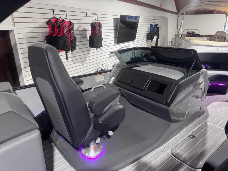 Slide: The Image of 2024 Berkshire 23 RFX DC STS3-93 boat interior with modern helm and seating. - 10