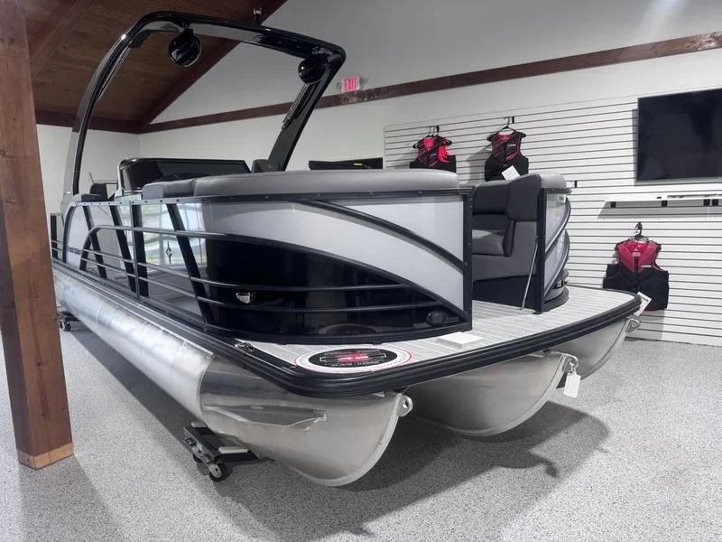 Slide: The Image of 2024 Berkshire 23 RFX DC STS3-93 pontoon boat displayed indoors. - 12