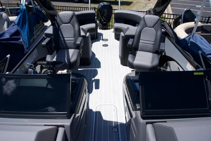 Slide: The Image of 2024 Berkshire 23 RFX DC STS3-93 pontoon boat interior with luxurious seating and modern design. - 2