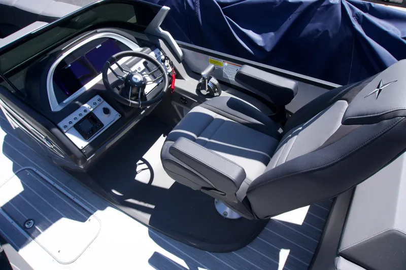 Slide: The Image of 2024 Berkshire 23 RFX DC STS3-93 boat cockpit with modern steering and seating. - 4