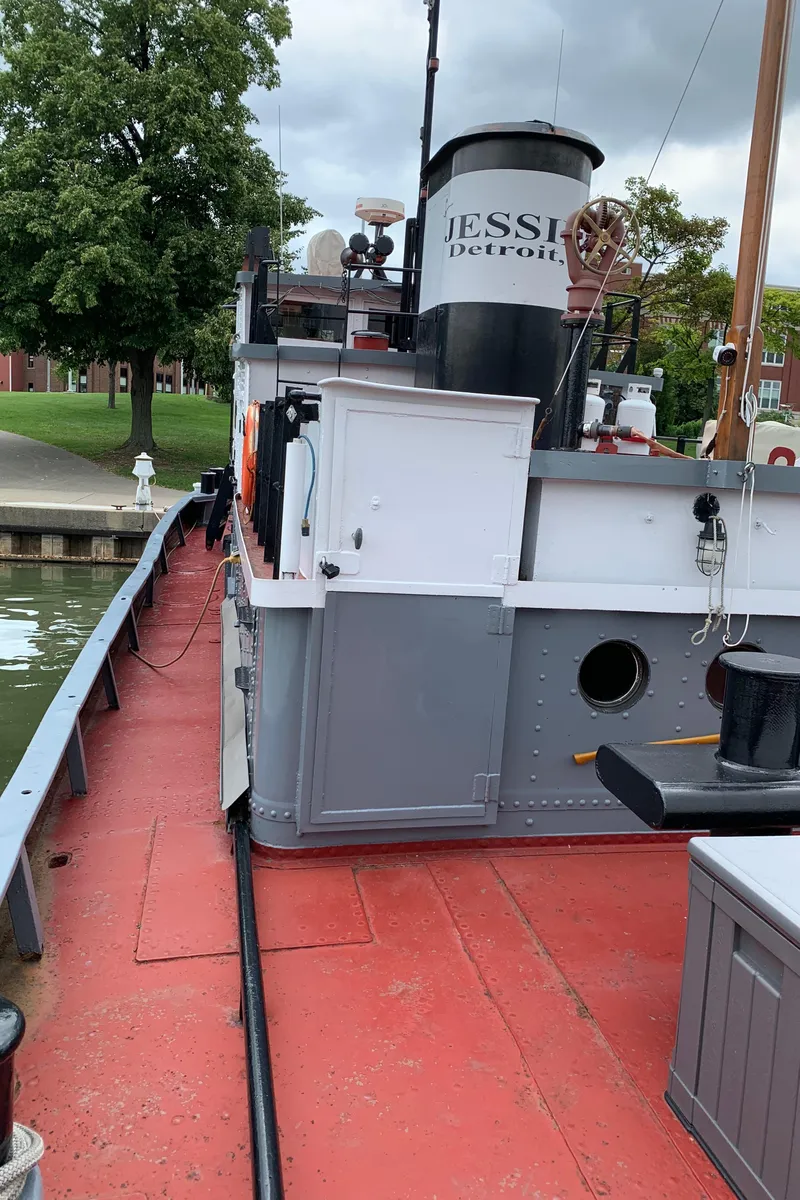 Slide: The Image of Historic 1936 Tugboat "Bow Steel" docked, showcasing vintage maritime design. - 18
