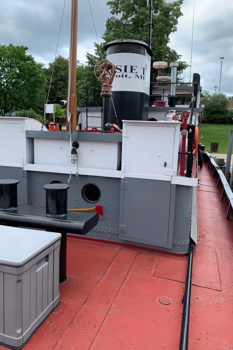 Slide: The Image of 1936 Tugboat Bow Steel on deck, showcasing vintage maritime design and equipment. - 19