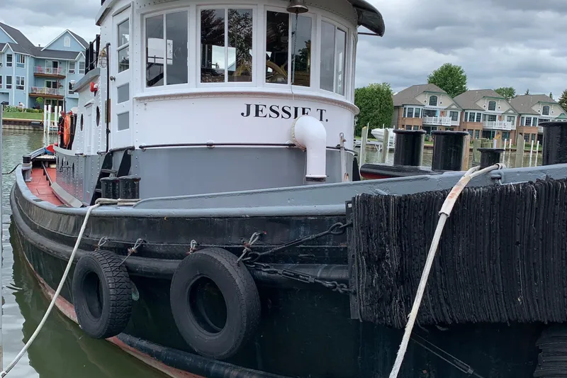Slide: The Image of Historic 1936 Tugboat "Jessie T." docked, showcasing classic Bow Steel design. - 3