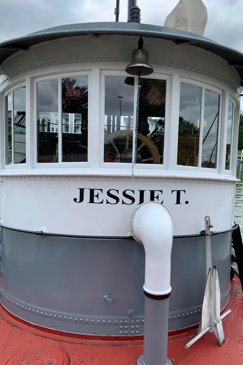 Slide: The Image of 1936 Tugboat Bow Steel "Jessie T." with classic design and white-gray exterior. - 6
