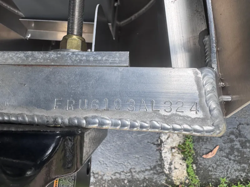 Slide: The Image of Close-up of a 2024 Berkshire 23RFX-STS3 metal component with serial number FRU6103AL324. - 8