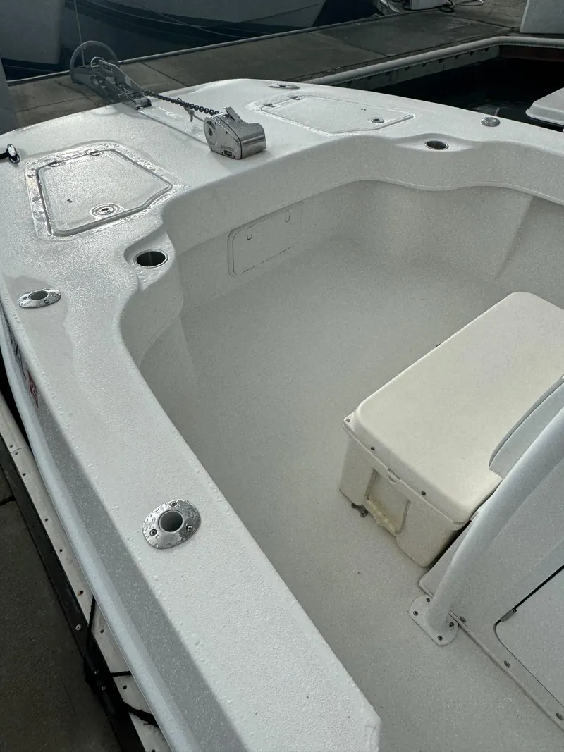 Slide: The Image of 2021 Twin Vee Catamaran boat interior with seating and storage compartments. - 8