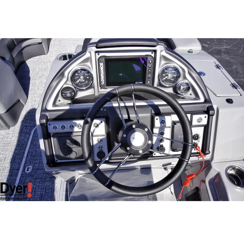 Slide: The Image of 2024 Berkshire 23SBE STS3-93 boat dashboard with steering wheel and navigation controls. - 10