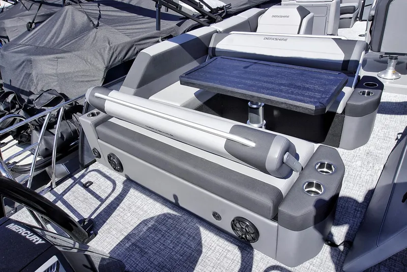 Slide: The Image of 2024 Berkshire 23SBE STS3-93 boat interior with seating and table. - 11