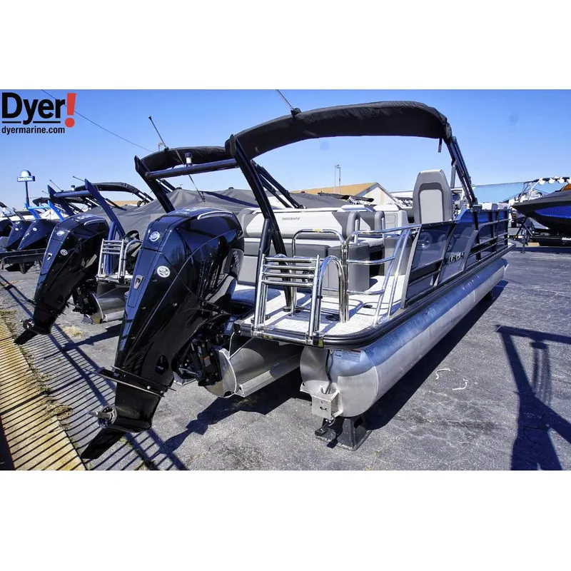 Slide: The Image of 2024 Berkshire 23SBE STS3-93 pontoon boat with outboard motor, displayed at Dyer Marine. - 2