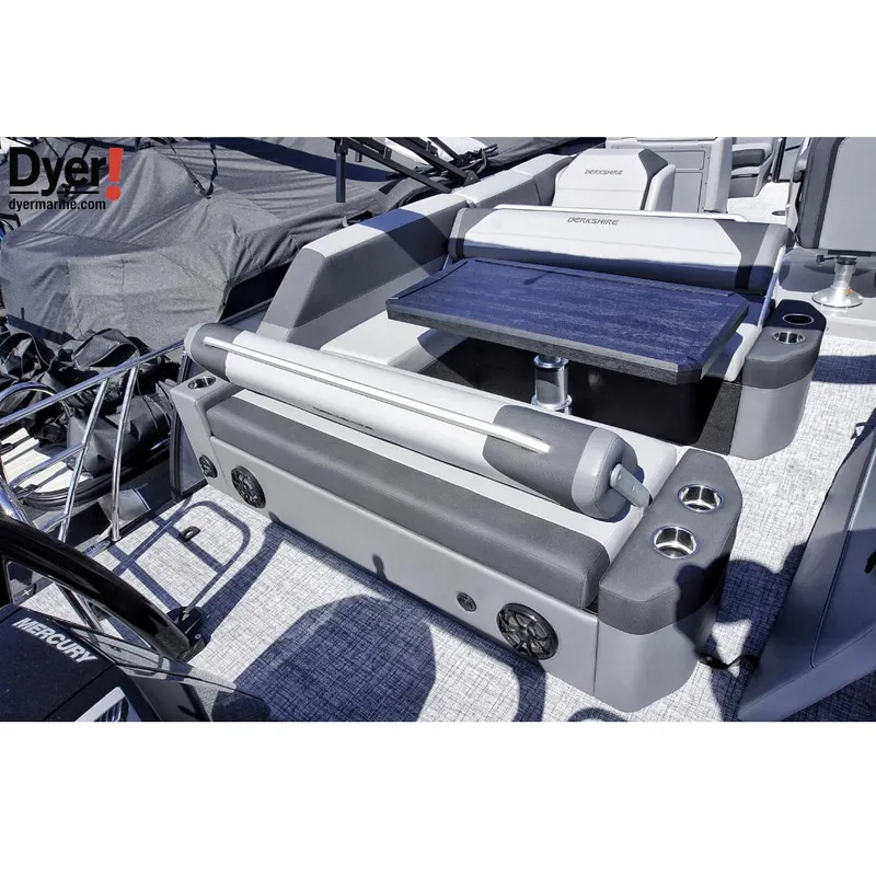 Slide: The Image of 2024 Berkshire 23SBE STS3-93 boat interior with seating and table setup. - 3