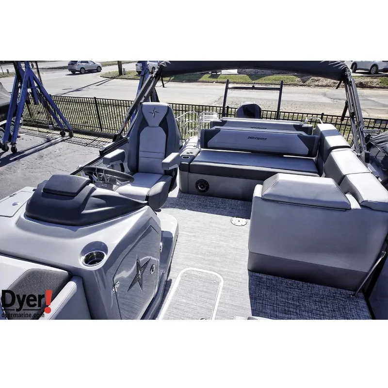 Slide: The Image of 2024 Berkshire 23SBE STS3-93 pontoon boat interior with modern seating and helm. - 6