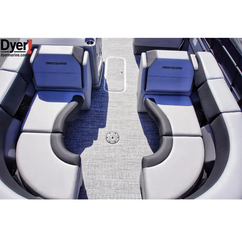 Slide: The Image of 2024 Berkshire 23SBE STS3-93 boat interior with curved seating and gray upholstery. - 7
