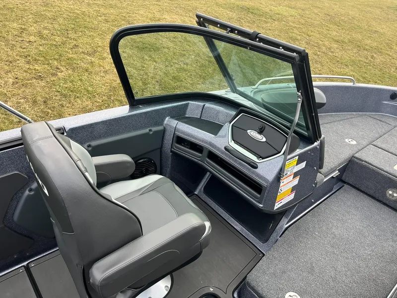 Slide: The Image of 2025 Lund 189 Tyee GL boat interior with seating and dashboard. - 10