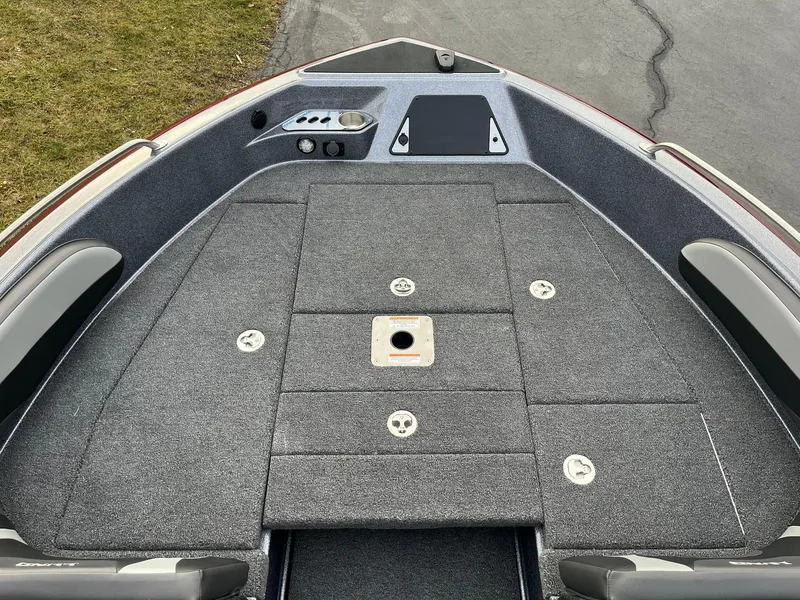 Slide: The Image of 2025 Lund 189 Tyee GL boat deck with storage compartments and seating area. - 11