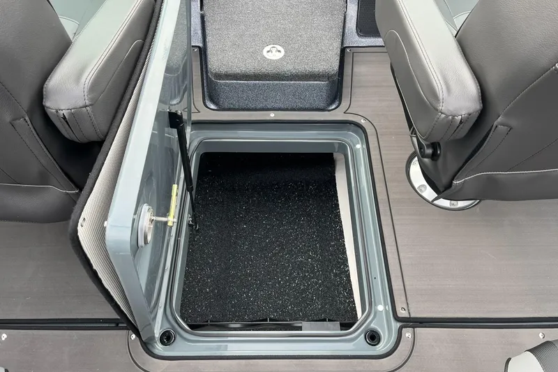 Slide: The Image of 2025 Lund 189 Tyee GL boat interior storage compartment with open hatch. - 19