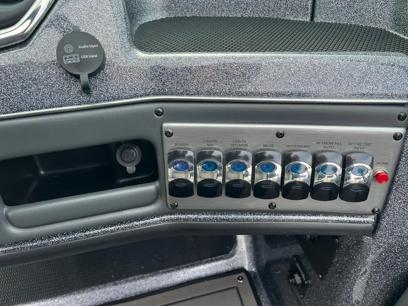 Slide: The Image of Control panel of 2025 Lund 189 Tyee GL boat with switches and USB port. - 20