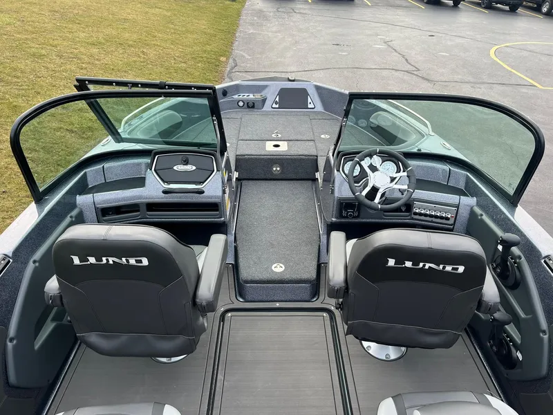 Slide: The Image of 2025 Lund 189 Tyee GL boat interior with dual seats and steering console. - 5