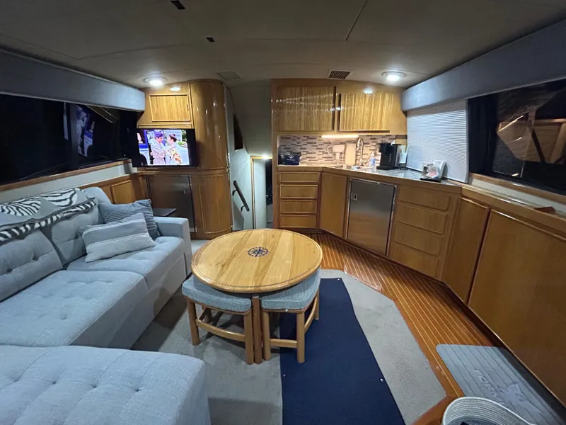 Slide: The Image of Interior of 1988 Bertram 43 Convertible yacht with modern kitchen and cozy seating area. - 17
