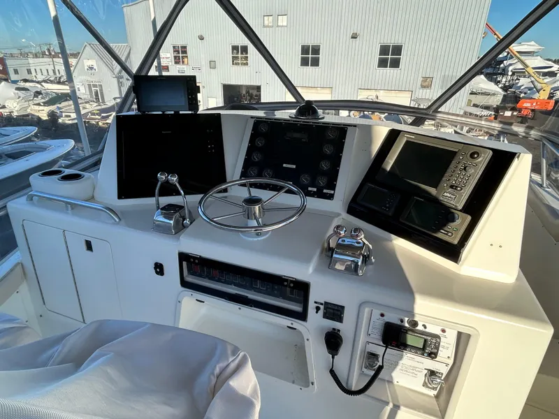 Slide: The Image of 1988 Bertram 43 Convertible helm with navigation equipment and steering wheel. - 20