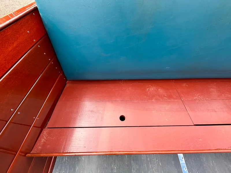 Slide: The Image of 1953 Chris-Craft 22 Sportsman wooden interior detail with blue and red finish. - 14