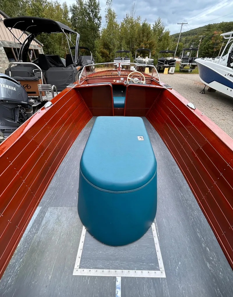 Slide: The Image of 1953 Chris-Craft 22 Sportsman boat with wooden interior and blue seating. - 17