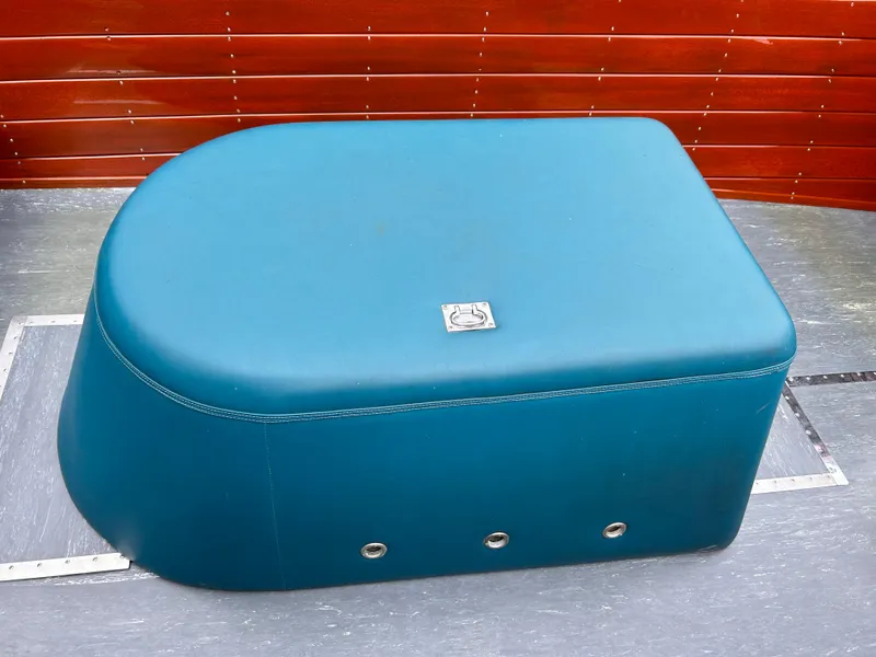 Slide: The Image of Teal seat cushion in a 1953 Chris-Craft 22 Sportsman boat interior. - 19