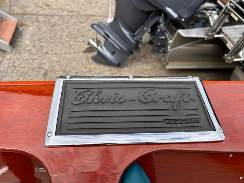 Slide: The Image of 1953 Chris-Craft 22 Sportsman nameplate on polished wooden surface. - 25