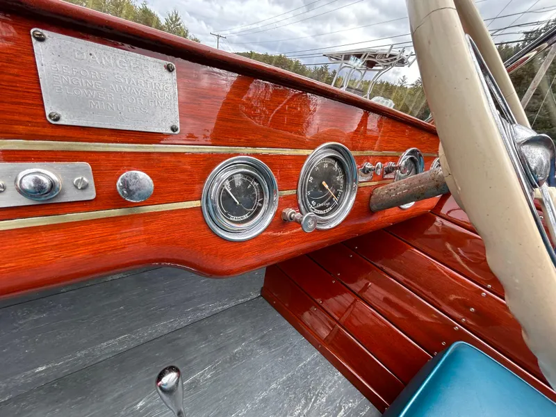 Slide: The Image of 1953 Chris-Craft 22 Sportsman dashboard with vintage gauges and wooden finish. - 31